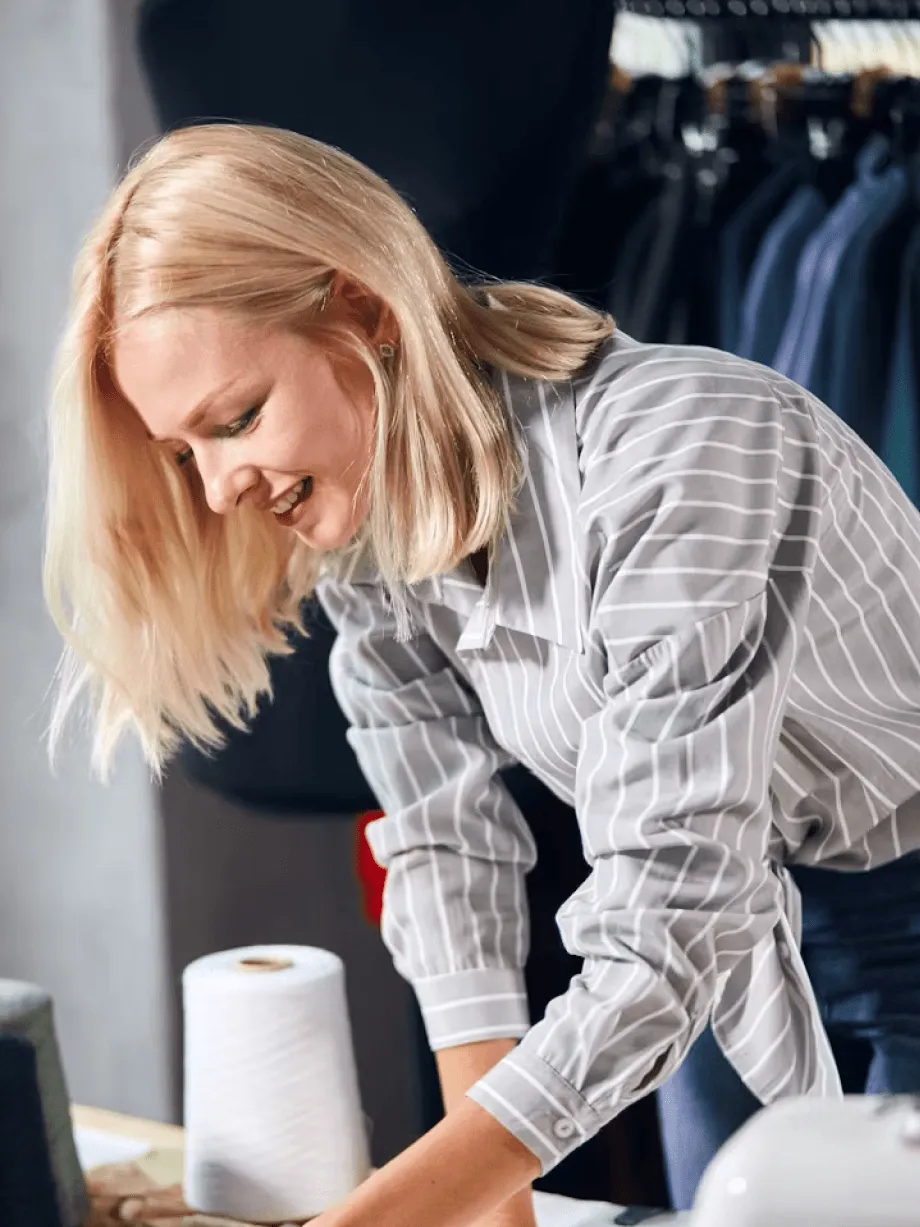 Founder packing orders in a small apparel workshop